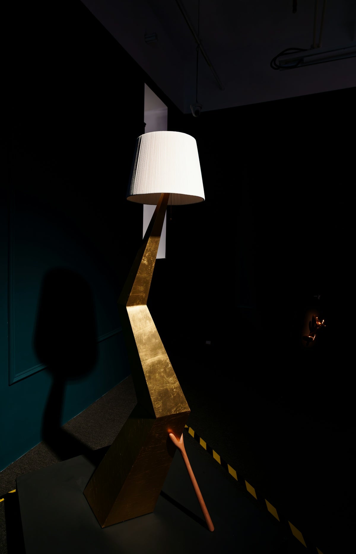 Modern geometric floor lamp with gold accents