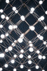Geometric light fixture with many glowing bulbs