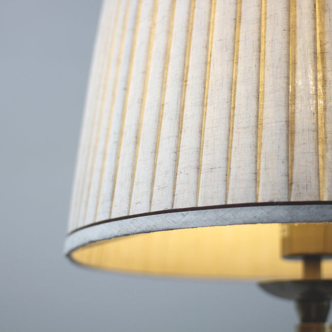Nicollete Floor Lamp with Brass Stand and Fabric Shade.