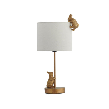 Two Rabbits Playing Table Lamp with Gold Base and White Fabric Shade.