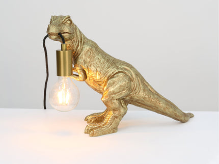 T-Rex Bite Table Lamp with Gold Finish and Unique Dinosaur Design.