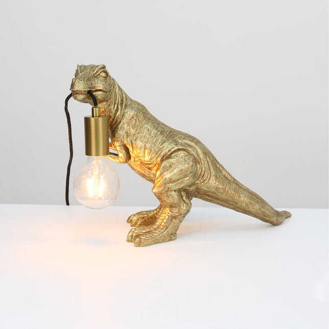 T-Rex Bite Table Lamp with Gold Finish and Unique Dinosaur Design.