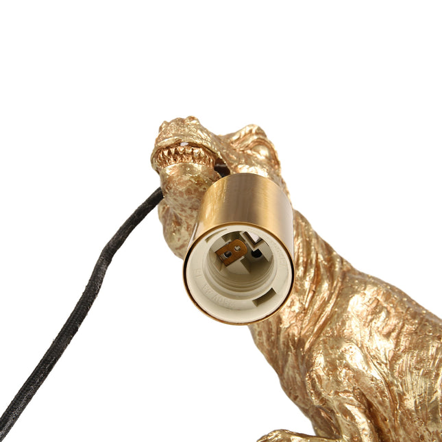 T-Rex Bite Table Lamp with Gold Finish and Unique Dinosaur Design.