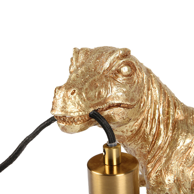 T-Rex Bite Table Lamp with Gold Finish and Unique Dinosaur Design.
