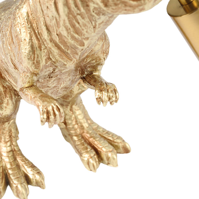 T-Rex Bite Table Lamp with Gold Finish and Unique Dinosaur Design.