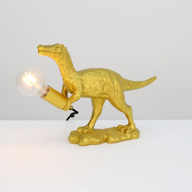 Velociraptor Grip Table Lamp with Gold Finish for Unique Home Decor.