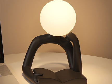 Black Creative Book Reader Desk Lamp USB Powered Modern Resin Design for Reading and Study.