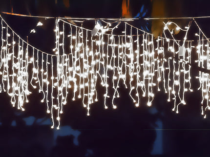 Elegant cool white LED curtain lights hanging for festive home decoration