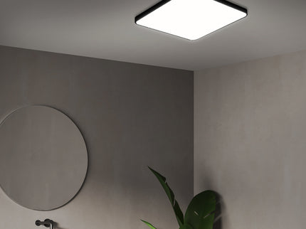 Modern ultra-thin LED ceiling light in a stylish bathroom setting with minimal décor